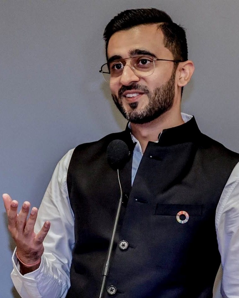 Yatin K Thakur speaking on stage